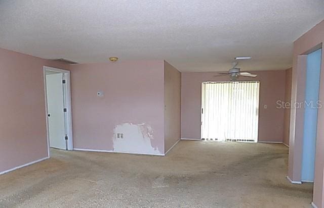 6309 35th Ave W, Bradenton, FL 34209 - empty room featuring a ceiling fan and a textured ceiling