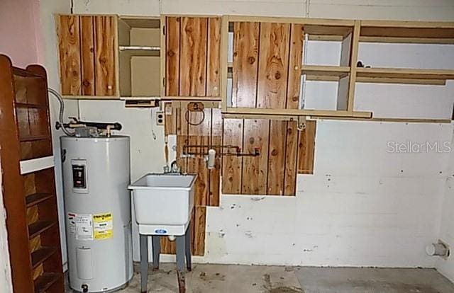 6309 35th Ave W, Bradenton, FL 34209 - utility room with a sink and electric water heater
