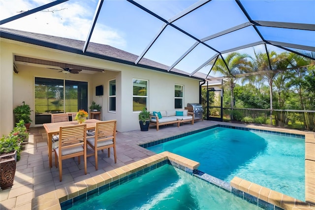 4162 Deep Creek Ter, Parrish, FL 34219 - view of swimming pool featuring a grill, a patio area, a pool with connected hot tub, a ceiling fan, and an outdoor living space