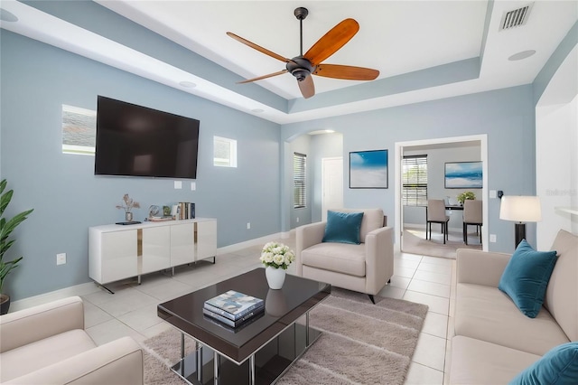 4162 Deep Creek Ter, Parrish, FL 34219 - living room featuring arched walkways, light tile patterned floors, visible vents, and a ceiling fan