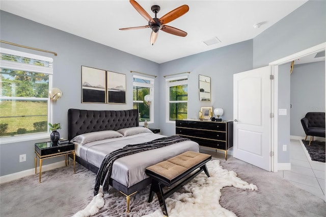 4162 Deep Creek Ter, Parrish, FL 34219 - tiled bedroom featuring ceiling fan, baseboards, multiple windows, and visible vents