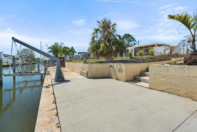 dock area featuring a water view and boat lift