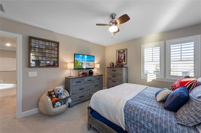 carpeted bedroom with baseboards, ceiling fan, and visible vents