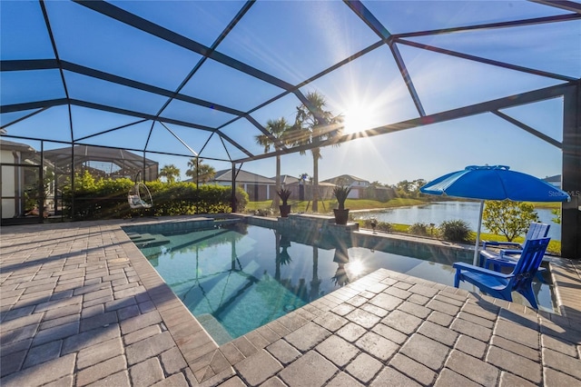 pool with a patio, a water view, and a lanai