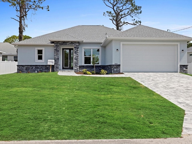 view of front of home with stucco siding, stone siding, and decorative driveway
