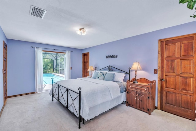 bedroom with visible vents, access to exterior, and light carpet