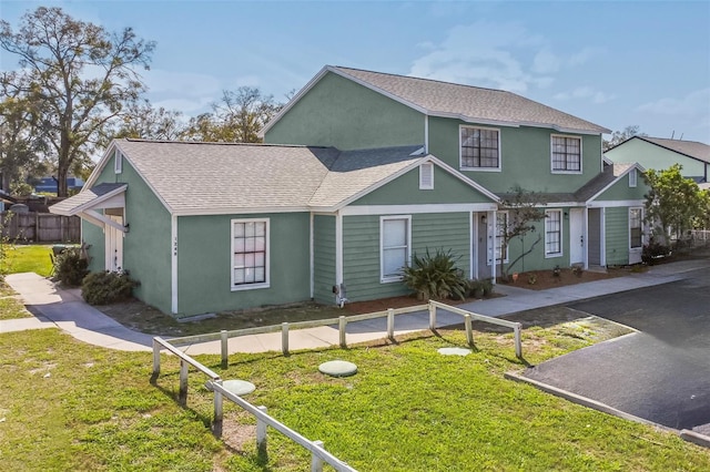 1236 Dovehill Dr, Apopka, FL 32703 - view of front facade featuring roof with shingles and stucco siding