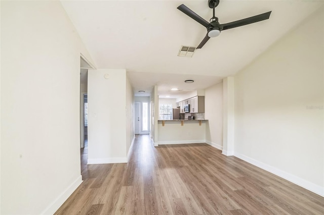 1236 Dovehill Dr, Apopka, FL 32703 - unfurnished living room featuring ceiling fan and light wood-style floors