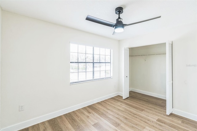1236 Dovehill Dr, Apopka, FL 32703 - unfurnished bedroom featuring light wood finished floors, a closet, and a ceiling fan