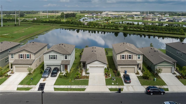 aerial perspective of suburban area with a large body of water