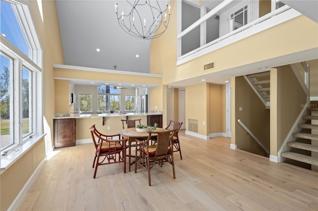 71 Tidy Island Blvd, Bradenton, FL 34210 - dining area with baseboards, light wood-style floors, stairs, and visible vents