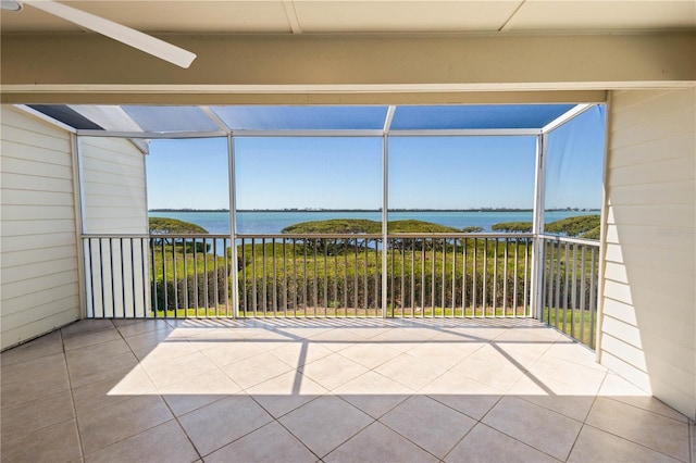 71 Tidy Island Blvd, Bradenton, FL 34210 - view of patio with a balcony, a water view, and glass enclosure
