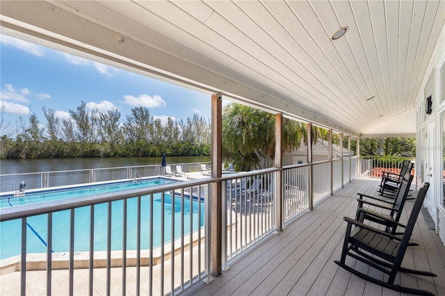 71 Tidy Island Blvd, Bradenton, FL 34210 - wooden terrace with a community pool and a water view