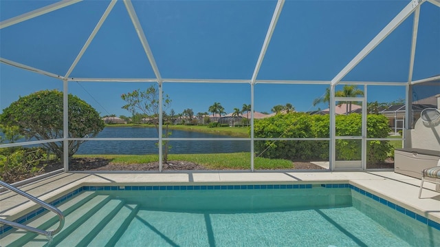 outdoor pool featuring a water view, a patio area, and glass enclosure