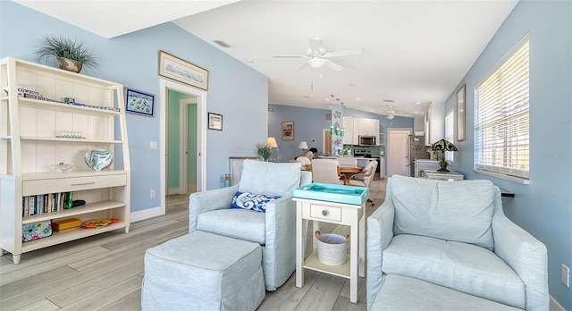 living area with baseboards, recessed lighting, light wood-style flooring, visible vents, and ceiling fan
