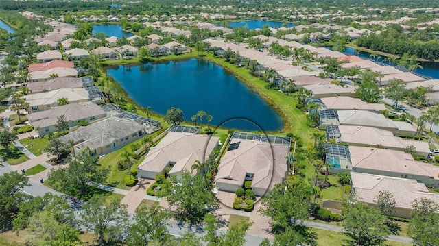 birds eye view of property with a water view and a residential view