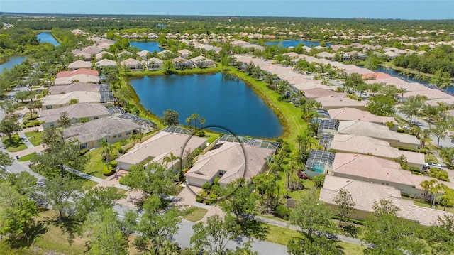 birds eye view of property featuring a water view and a residential view