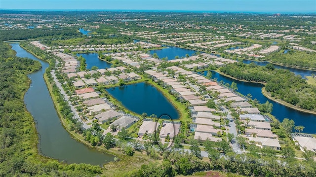 birds eye view of property featuring a residential view and a water view