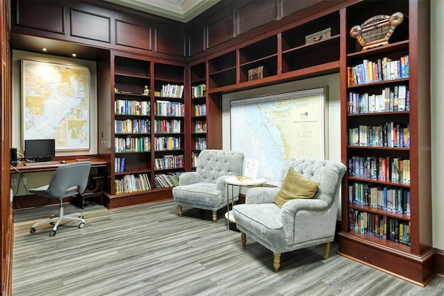 office space featuring wood finished floors and built in features