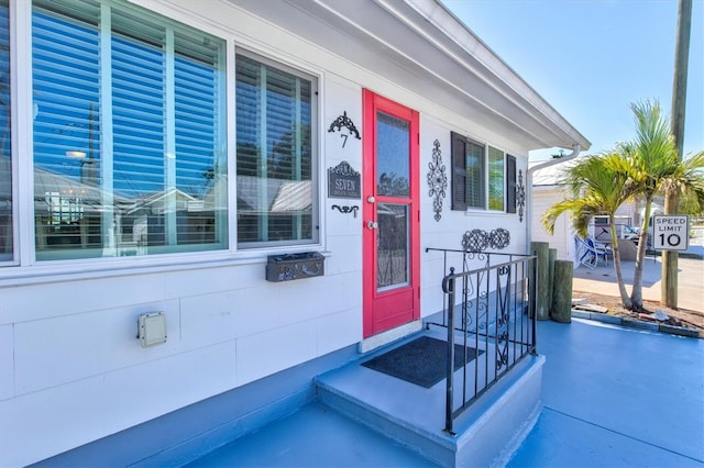 view of exterior entry featuring a porch