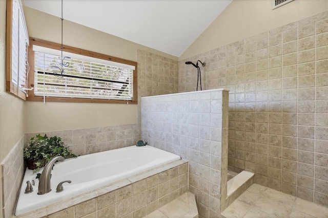full bath featuring a bath, lofted ceiling, and a walk in shower
