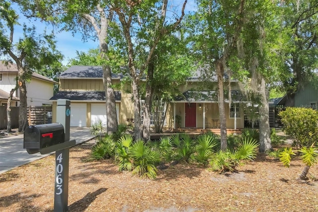 view of front of property featuring an attached garage and concrete driveway