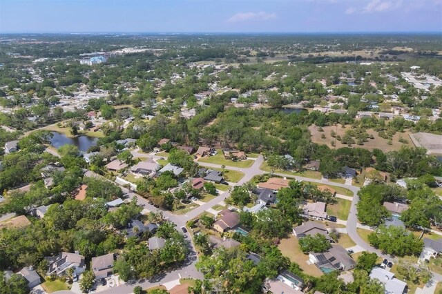 drone / aerial view with a residential view and a water view