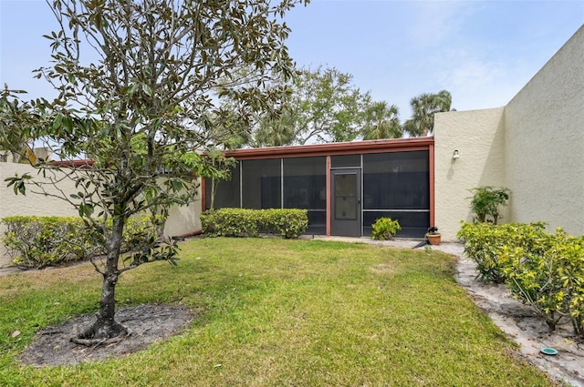 view of yard featuring a sunroom
