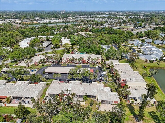 drone / aerial view featuring a residential view and a water view