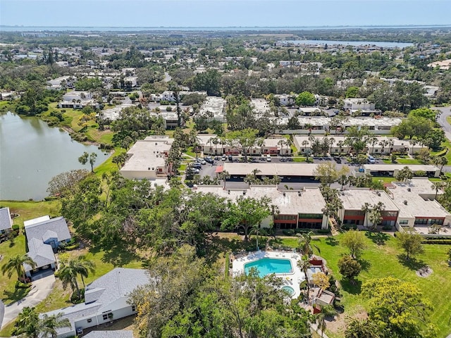 drone / aerial view with a residential view and a water view