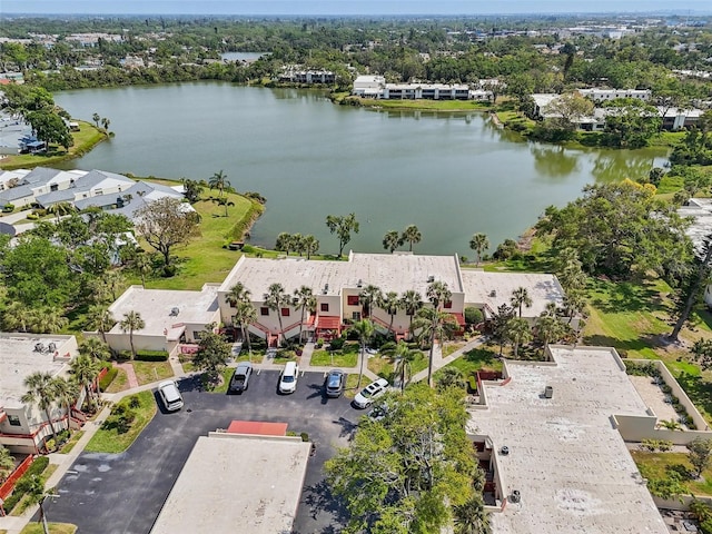 drone / aerial view with a residential view and a water view