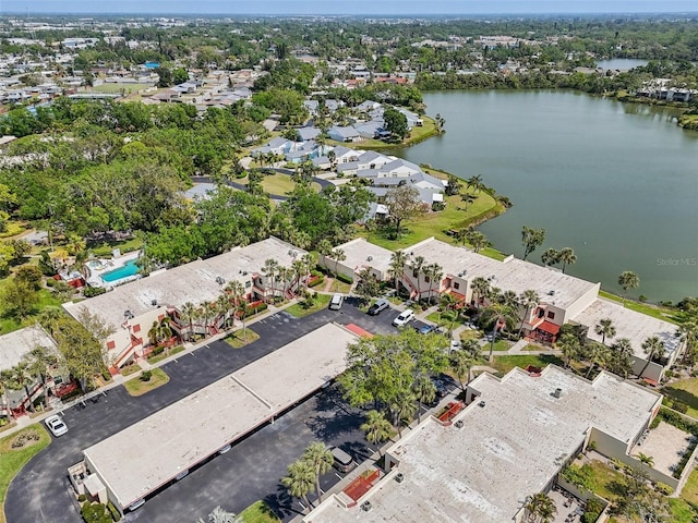 bird's eye view featuring a water view and a residential view