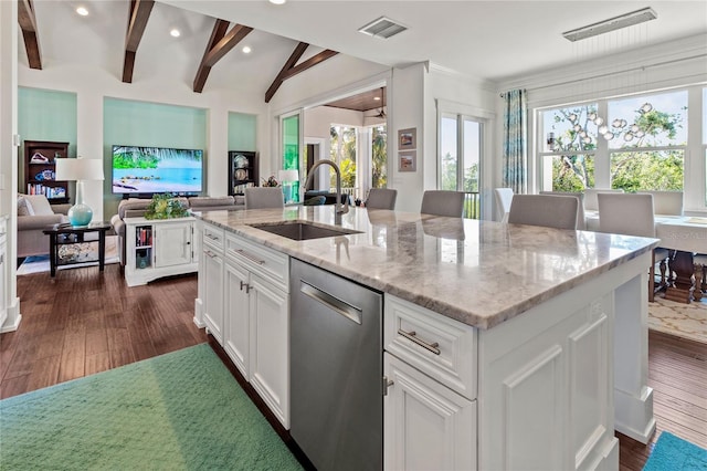 kitchen featuring open floor plan, stainless steel dishwasher, a sink, dark wood-style floors, and visible vents