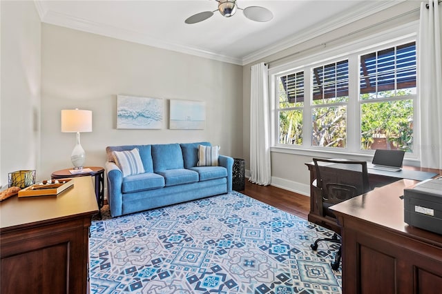 office with dark wood finished floors, crown molding, baseboards, and ceiling fan