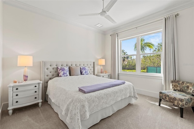 carpeted bedroom with baseboards, ornamental molding, and ceiling fan