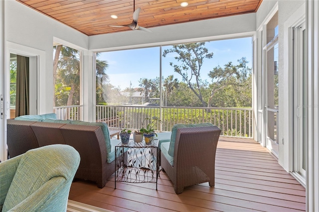 sunroom with an outdoor hangout area, a ceiling fan, wooden ceiling, and wood-type flooring