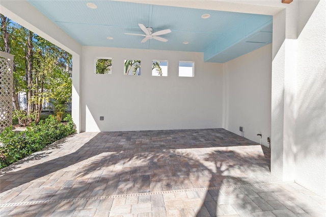 exterior space featuring ceiling fan