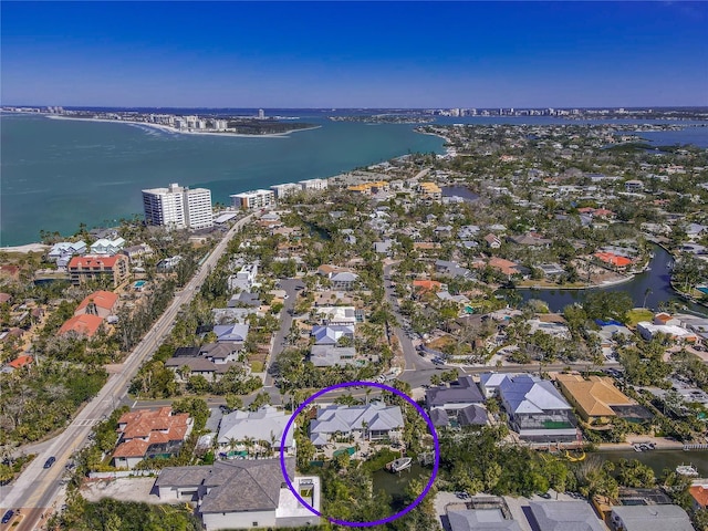 bird's eye view featuring a water view and a residential view