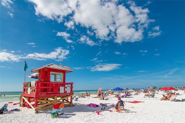 view of play area featuring a beach view and a water view