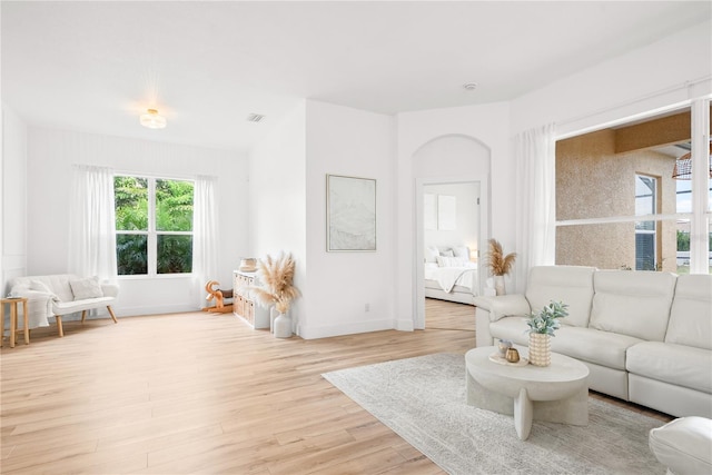 1189 Fraser Pine Blvd, Sarasota, FL 34240 - living area with light wood-style floors, visible vents, and baseboards