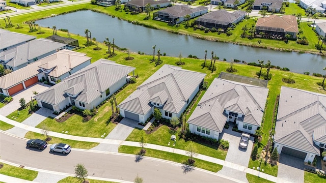 aerial perspective of suburban area with a large body of water