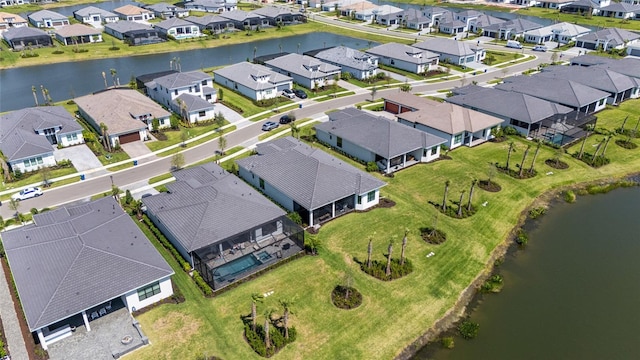 aerial overview of property's location with nearby suburban area and a nearby body of water