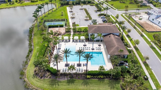 bird's eye view of a pool and a nearby body of water