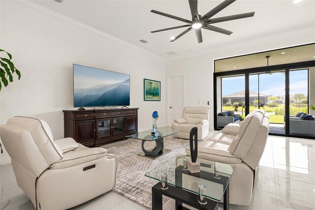 living area with marble finish floors, ornamental molding, a ceiling fan, and recessed lighting