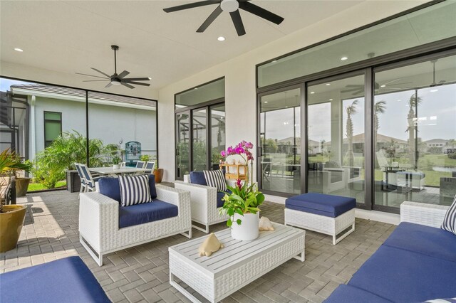 view of patio featuring ceiling fan and outdoor dining space