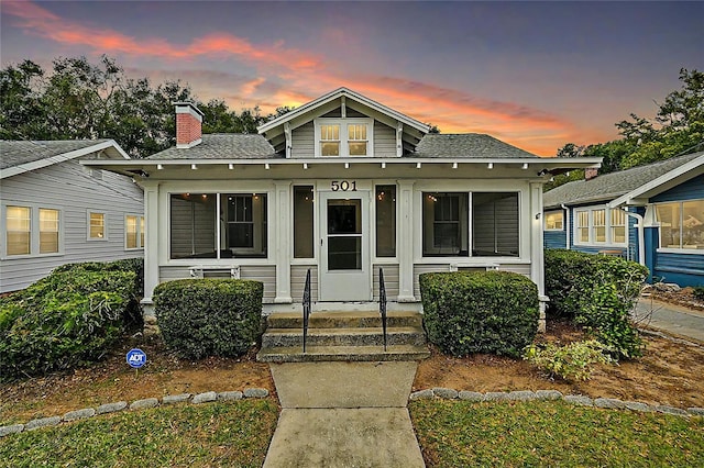 501 Washington Ave, Eustis, FL 32726 - bungalow featuring a shingled roof and a chimney