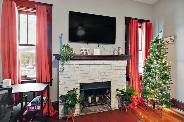 501 Washington Ave, Eustis, FL 32726 - living area with a fireplace and a wealth of natural light