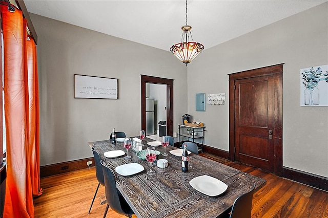 501 Washington Ave, Eustis, FL 32726 - dining room featuring electric panel, baseboards, and wood finished floors