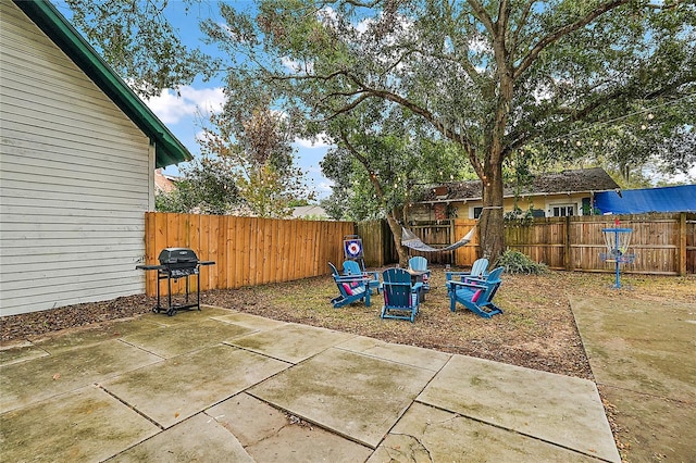 501 Washington Ave, Eustis, FL 32726 - exterior space featuring a grill, a fire pit, and a fenced backyard