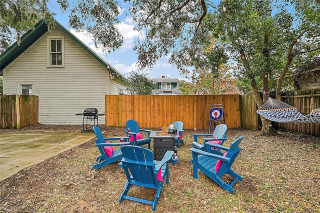 501 Washington Ave, Eustis, FL 32726 - view of yard featuring a fire pit, fence, and a patio area
